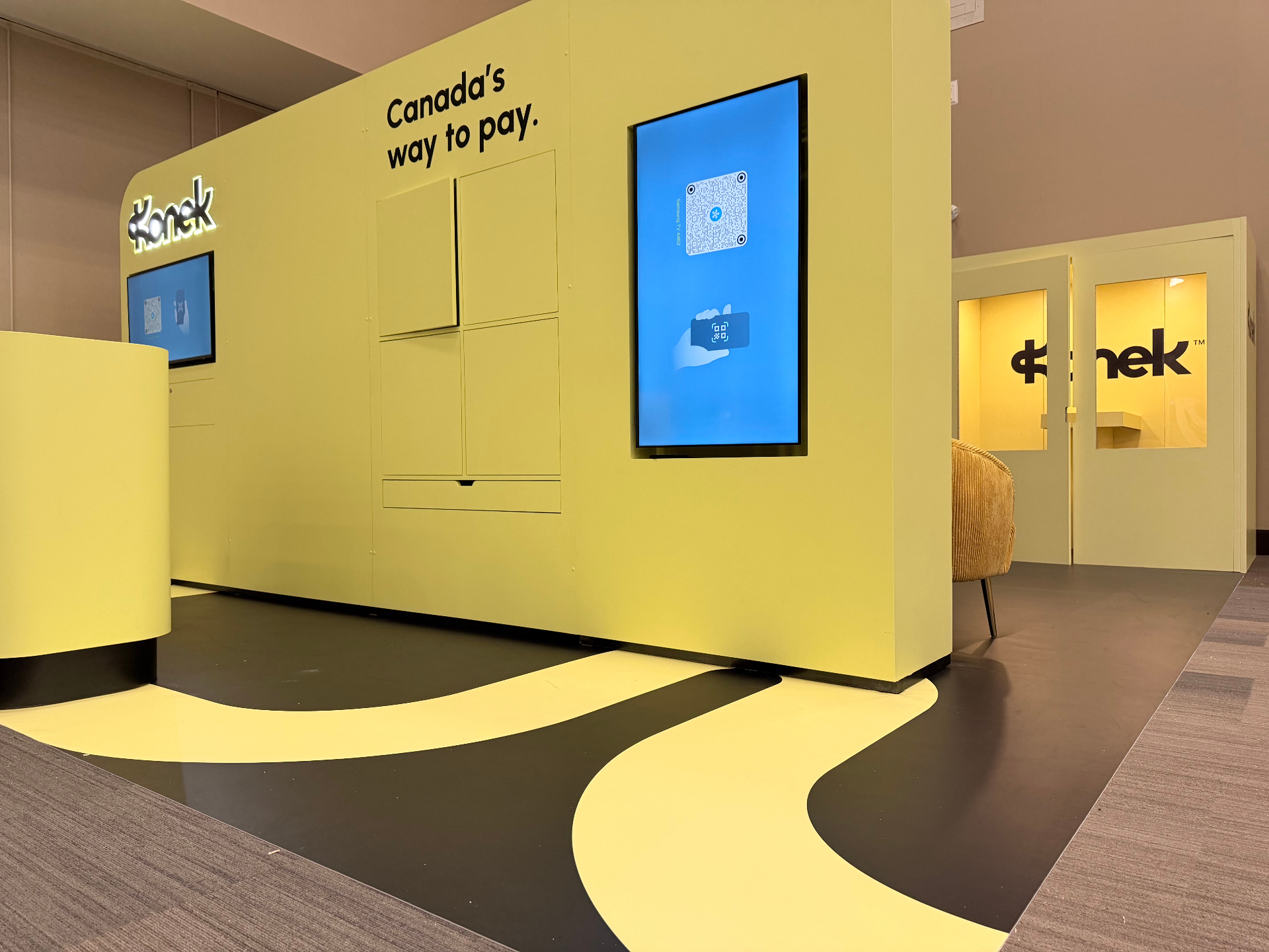 Branded event environment with graphic walls and digital displays